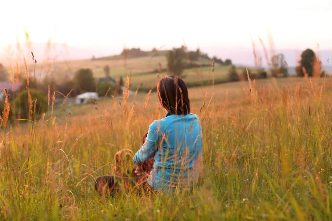 woman sitting in grass